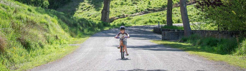 Child biking at Centennial Park