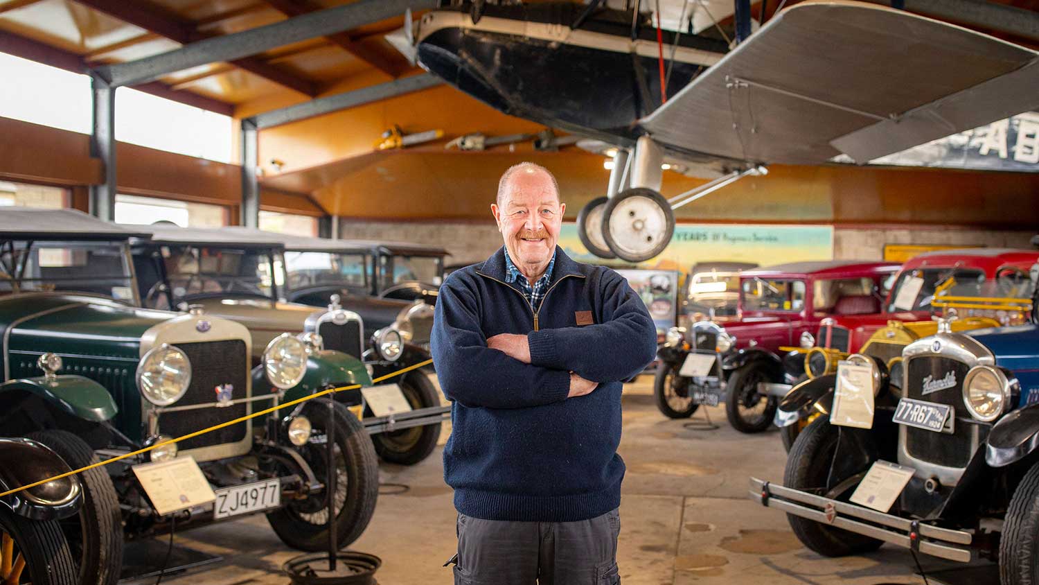 Man standing in the Geraldine Vintage Car and Machinery Museum